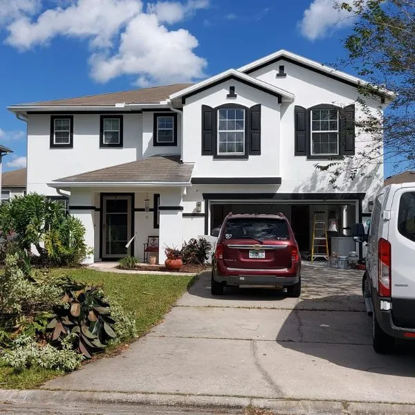 Benjamin Drywall House Exterior with Red Car